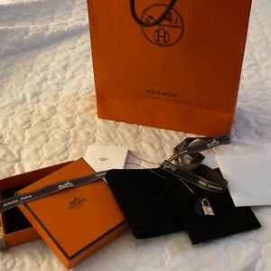 Hermès Gold Lock Charm with Black Tag